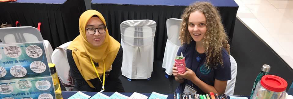 Sydney working with and informing locals in Malaysia about recycling.   